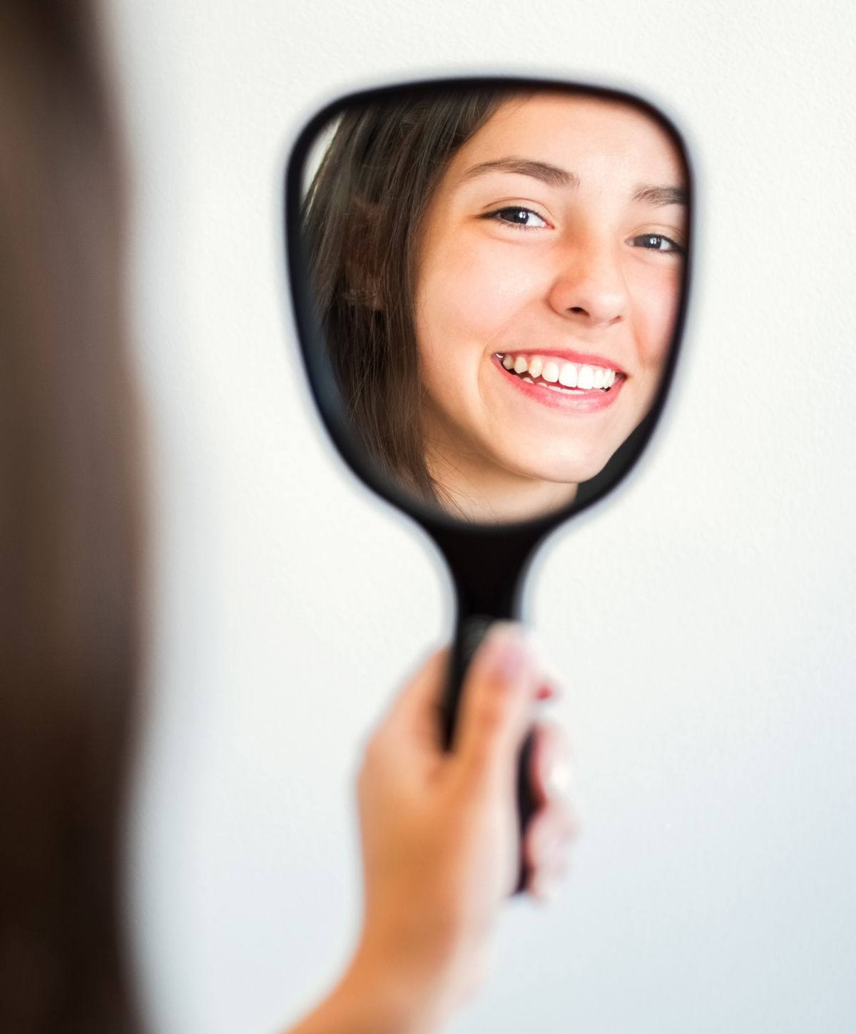 paramus dental implants model with dark hair