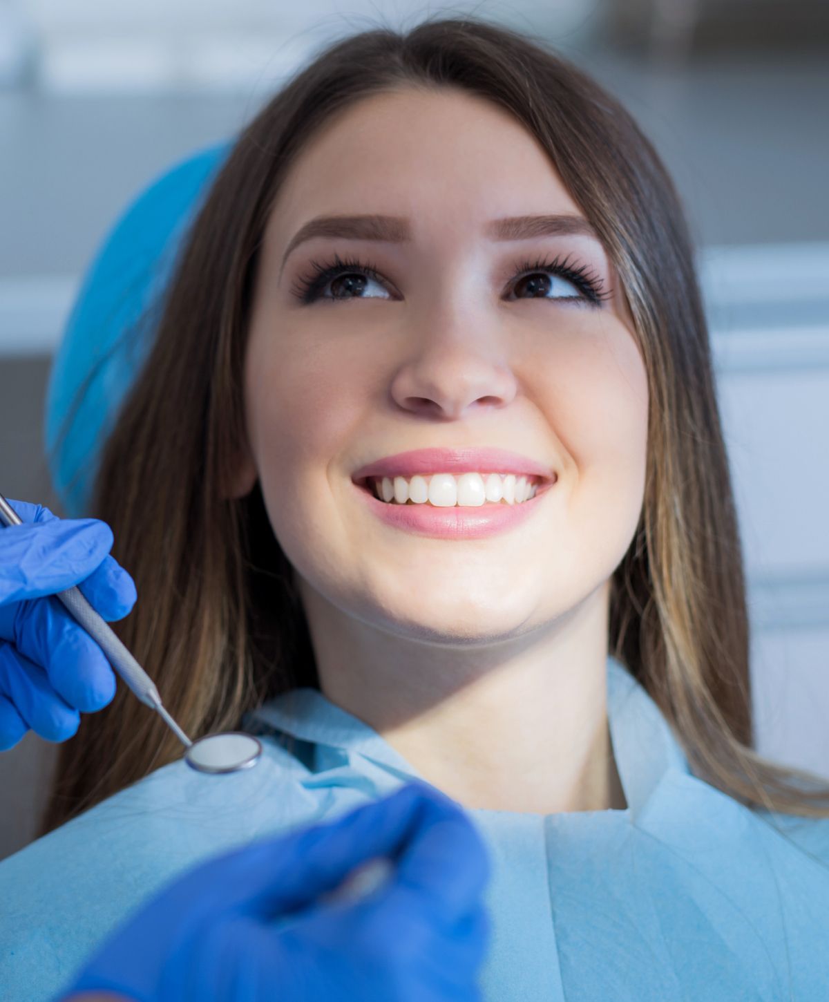 paramus dental implants patient model with brown hair